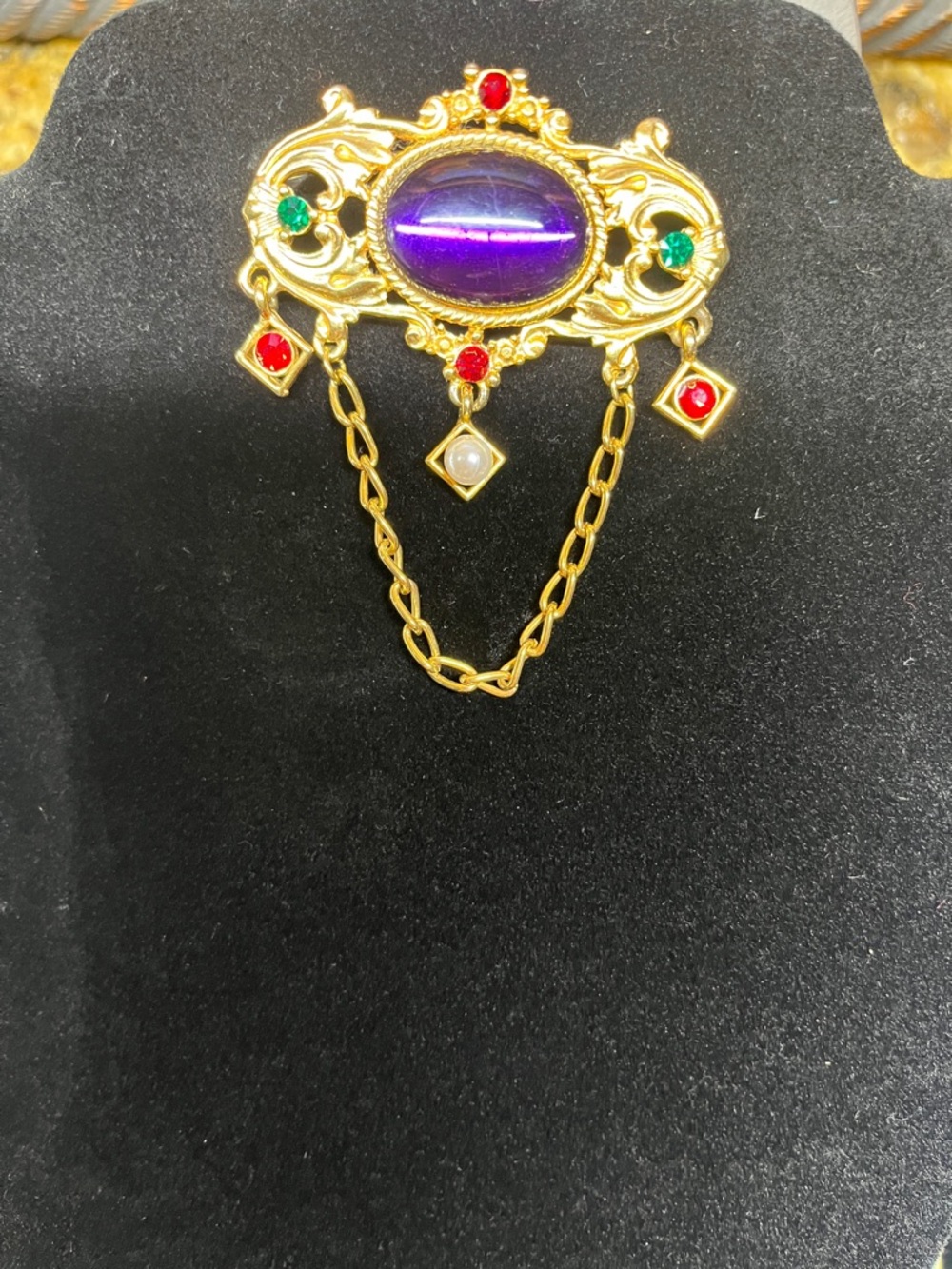 Vintage-Inspired Gold Brooch with Purple Cabochon and Red & Green Accents